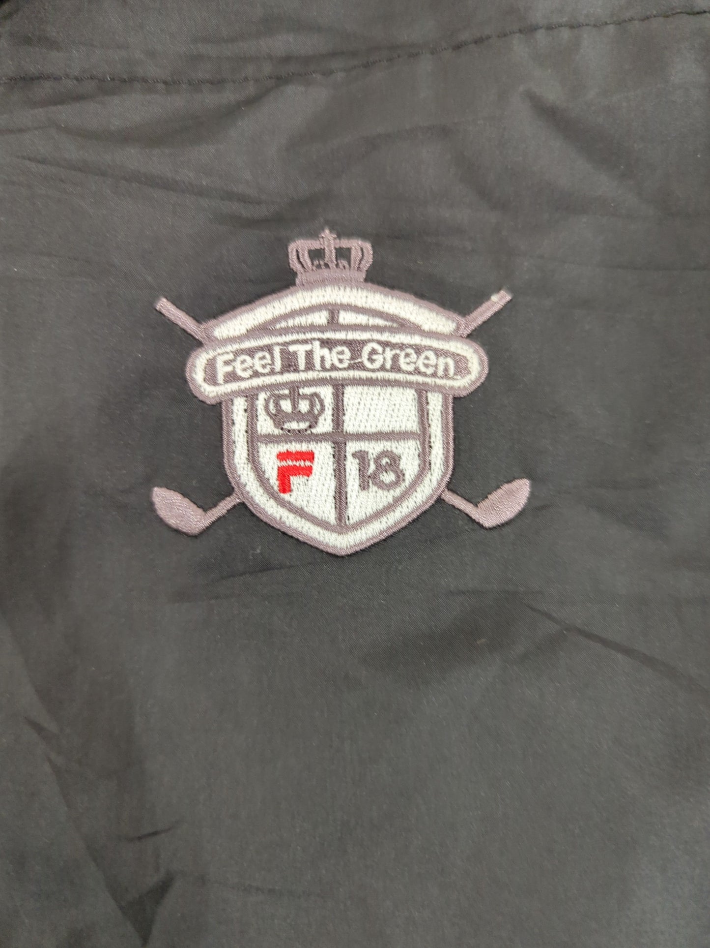 FILA Golf Windbreaker Jacket - Black with 'Feel The Green' Logo